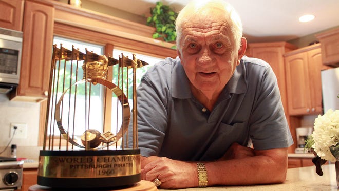 Bob Oldis, Iowa City resident and 1960 World Series champion with the Pittsburgh Pirates, poses in his kitchen with his World Series trophy on Wednesday, Sept. 9, 2015.