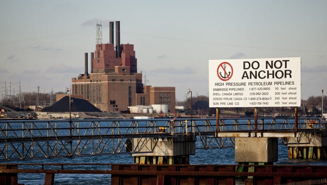 A sign warns boaters of pipelines under the St. Clair River on Friday, Jan. 2, 2015 in Corunna, Ontario.