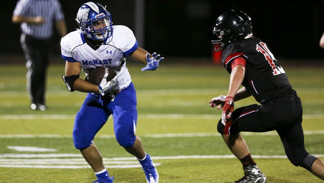 McNary Marc Baiza looks to head off North Salem's Michael Bolen in the season opening-game on Friday, Sept. 2, 2016, at North Salem High School. McNary won the match-up 38-35.