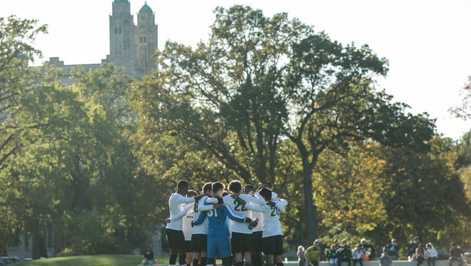 Marygrove College men's soccer players huddle before the second half of a game against University of Northwestern Ohio at Marygrove College on Tuesday, October 17, 2017.