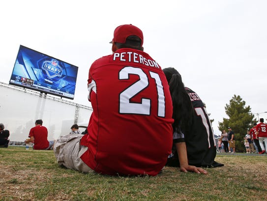 Arizona Cardinals fans watch the action at the draft