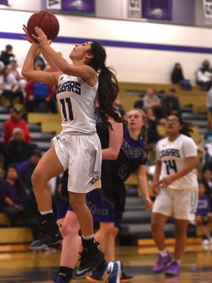 Spanish Springs' Naelia Pinedo (11) drives to the basket while taking on McQueen during their basketball game at Spanish Springs on Jan. 26, 2018.