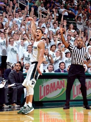 Bryn Forbes makes a 3-pointer in front of the Izzone during the game against Northern Michigan in November.