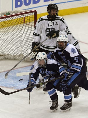 CBA's Liam Noonan (14) and Nic Lidondici (15) celebrate after Noonan's goal vs. Delbarton in the NJSIAA Non-Public hockey final at the Prudential Center in Newark. The Green Wave won 3-1. March 7, 2016. Newark, N.J. 