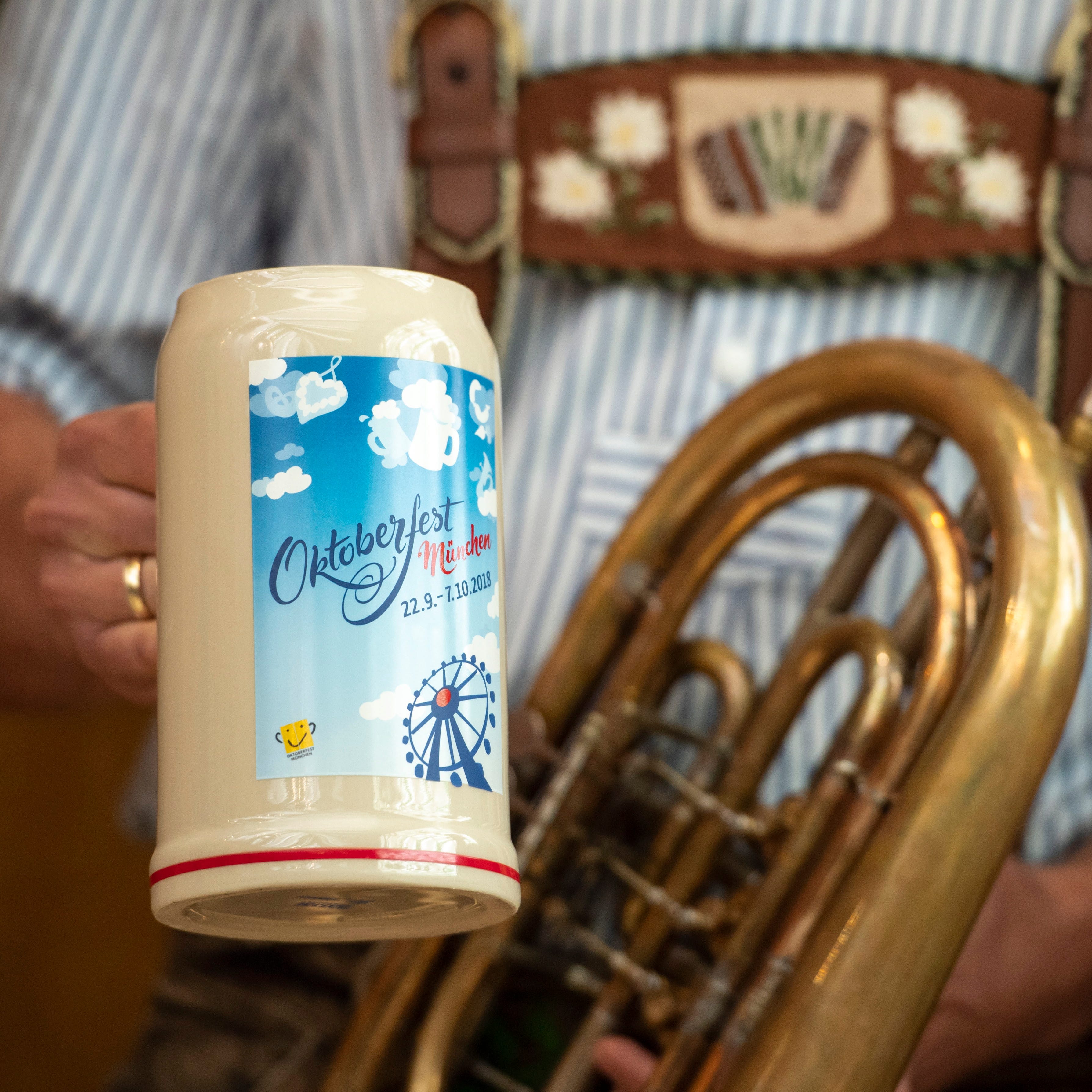 A musician presents the official Oktoberfest beer mug for 2018 on the Oktoberfest grounds in Munich. The World's largest beer festival will be held from Sept. 22 to Oct. 7.