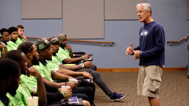 Seattle Seahawks coach Pete Carroll talks with rookies at the football team's training camp Monday, June 20, 2016, in Renton, Wash. The team is holding a rookie symposium for the new players to give them information about the NFL.