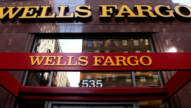 Photo taken in 2012 shows a Wells Fargo sign displayed on one of the bank's branches in New York City.