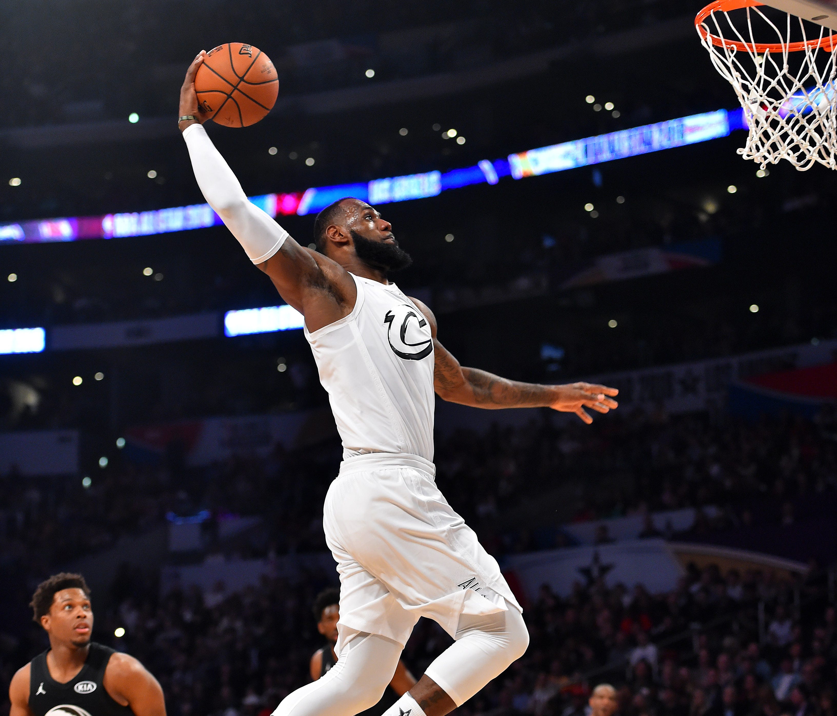 LeBron James goes up for a dunk during the All-Star Game.