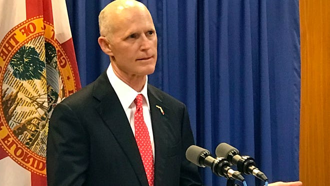Gov. Rick Scott takes questions during a news conference on environmental issues at the state capitol April 17, 2017, in Tallahassee.