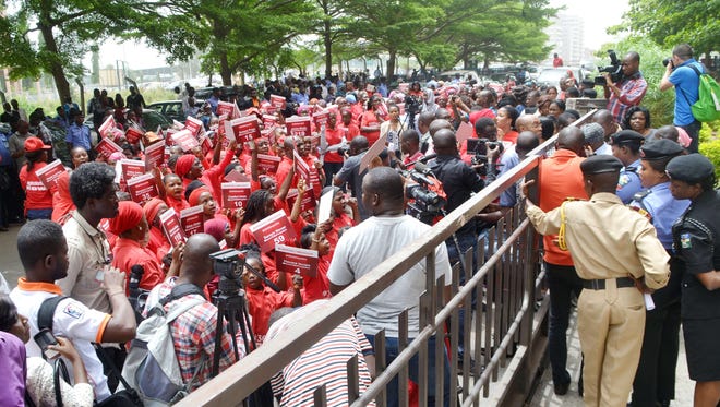Civil society groups press for the release of 219 schoolgirls abducted by Boko Haram Islamists during a demonstration at the Ministry of Education in Abuja, on April 14, 2015.