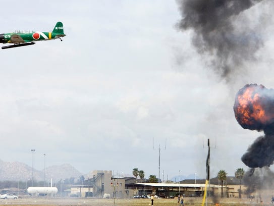 Planes reenact the attack on Pearl Harbor during a