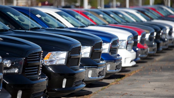 Ram pickup trucks are lined up at a dealership in Georgia.
