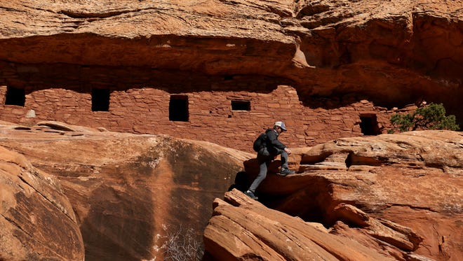 A hiker explores The Citadel, an ancient ruin within the Bears Ears National Monument, in southern Utah in November of 2017.
