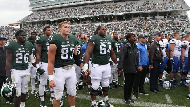 Michigan State players joined Air Force as they sung the Air Force fight song at the end of the game on Saturday at Spartan Stadium.