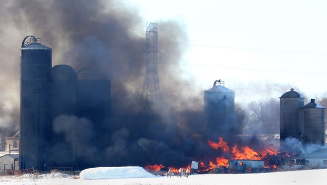 Sixty cows were in a barn in Ellington that caught fire on Tuesday morning. Two cows died.