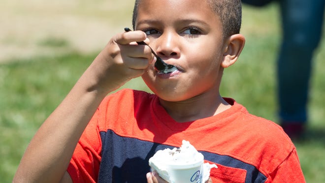 Steven Beachum Jr. of Newark enjoys a cold treat at the New Castle Ice Cream Festival.