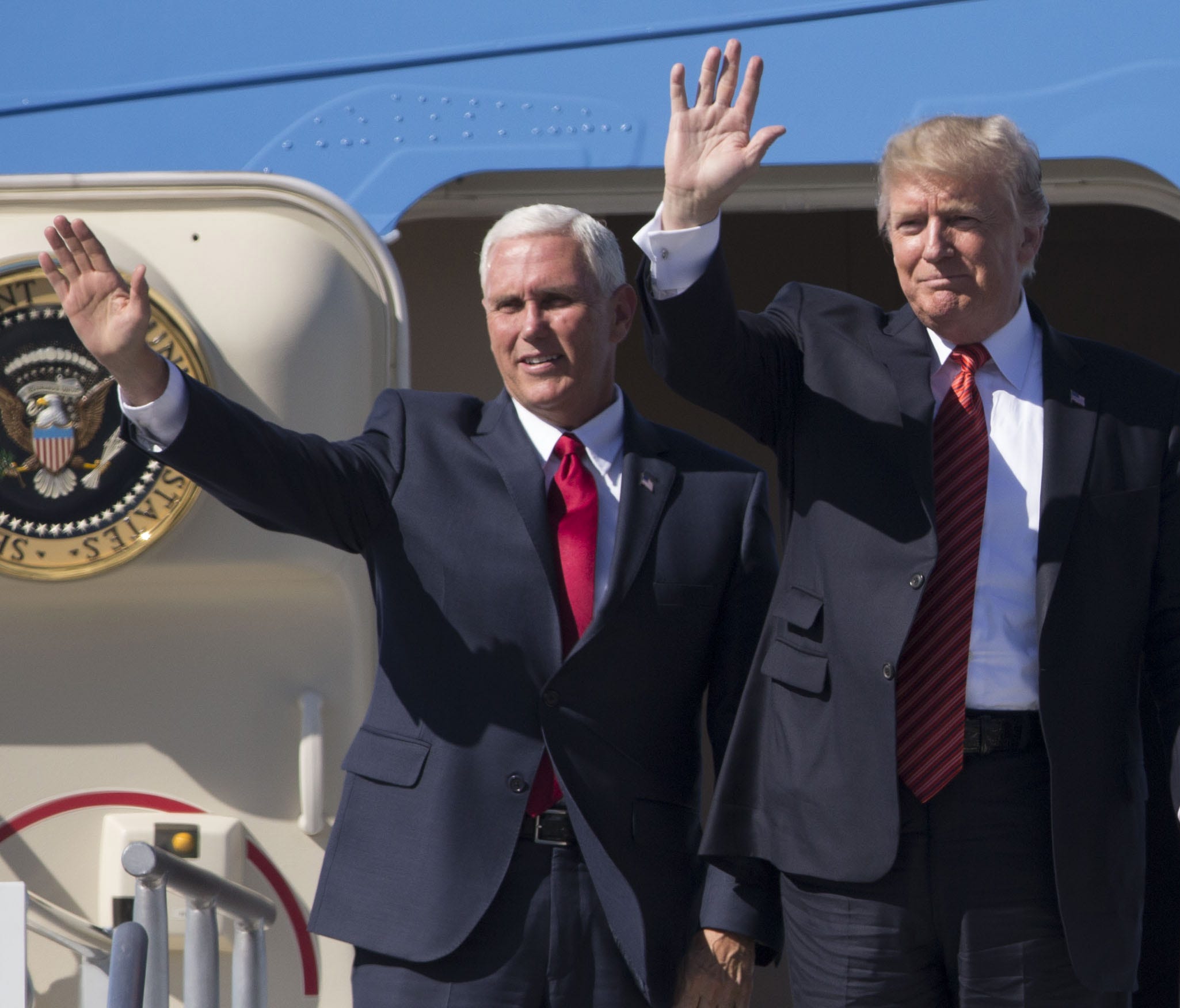 President Donald Trump and Vice President Mike Pence wave to supporters at Phoenix Sky Harbor International Airport on Aug. 22, 2017.