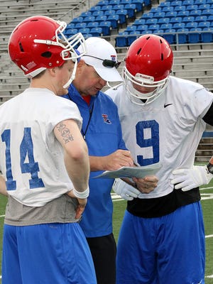Louisiana Tech coach Skip Holtz, centers, enters his fourth year as the Bulldogs' coach with several questions on offense and defense.