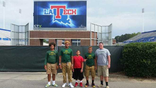 New Louisiana Tech commit Willie Baker, second from left, poses for a picture before Saturday's scrimmage in Ruston.