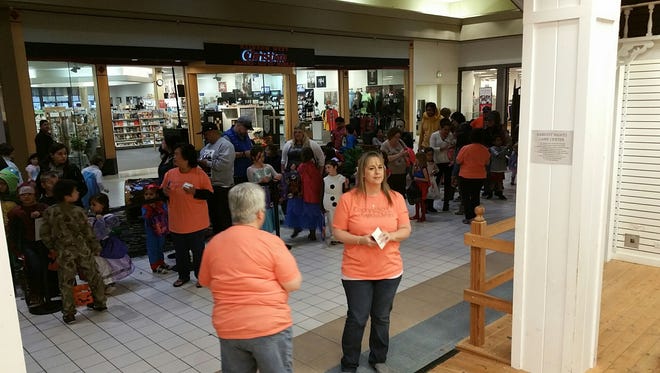An estimated 5,000 trick-or-treaters collected candy from inside the Lancaster Mall on Halloween.