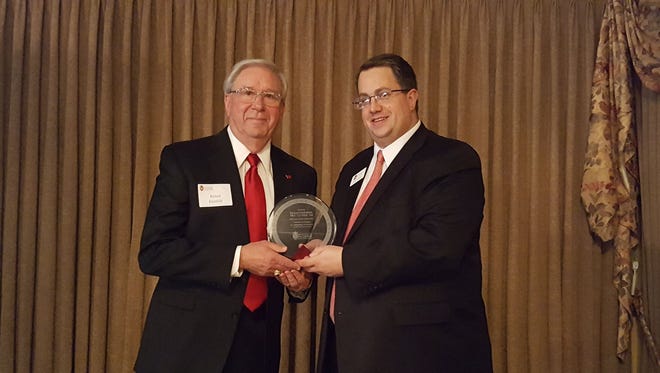Richard "Dick" Kleinfeldt received the Fond du Lac Chapter's Badger of the Year award. Also pictured: Steve Leaman.