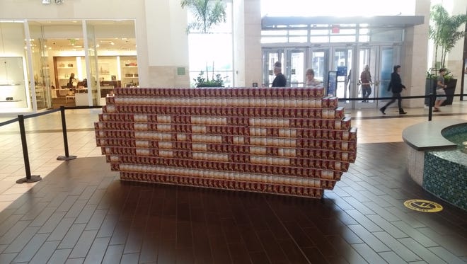 A team from H-E-B created the store's logo out of cans during the Canstruction event Saturday, Feb. 18, 2017, at La Palmera mall. H-E-B sponsored the event.