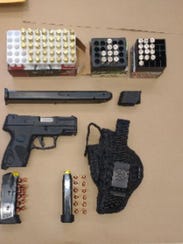 Police found a gun, ammunition and drugs inside the