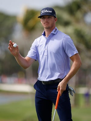 Morgan Hoffmann acknowledges the crowd after putting on the ninth hole during the first round of the Honda Classic golf tournament, Thursday, Feb. 22, 2018 in Palm Beach Gardens, Fla. (AP Photo/Wilfredo Lee)