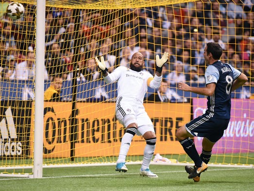 Colorado Rapids goalkeeper Tim Howard reacts after