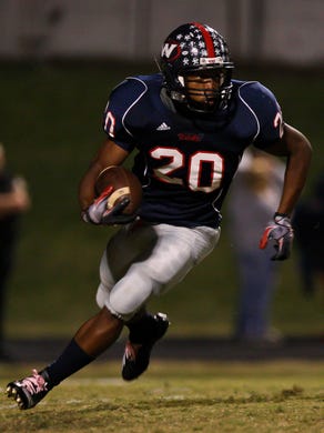 West running back Josh Davenport carries the ball at West High School Friday, Oct. 7 2011.