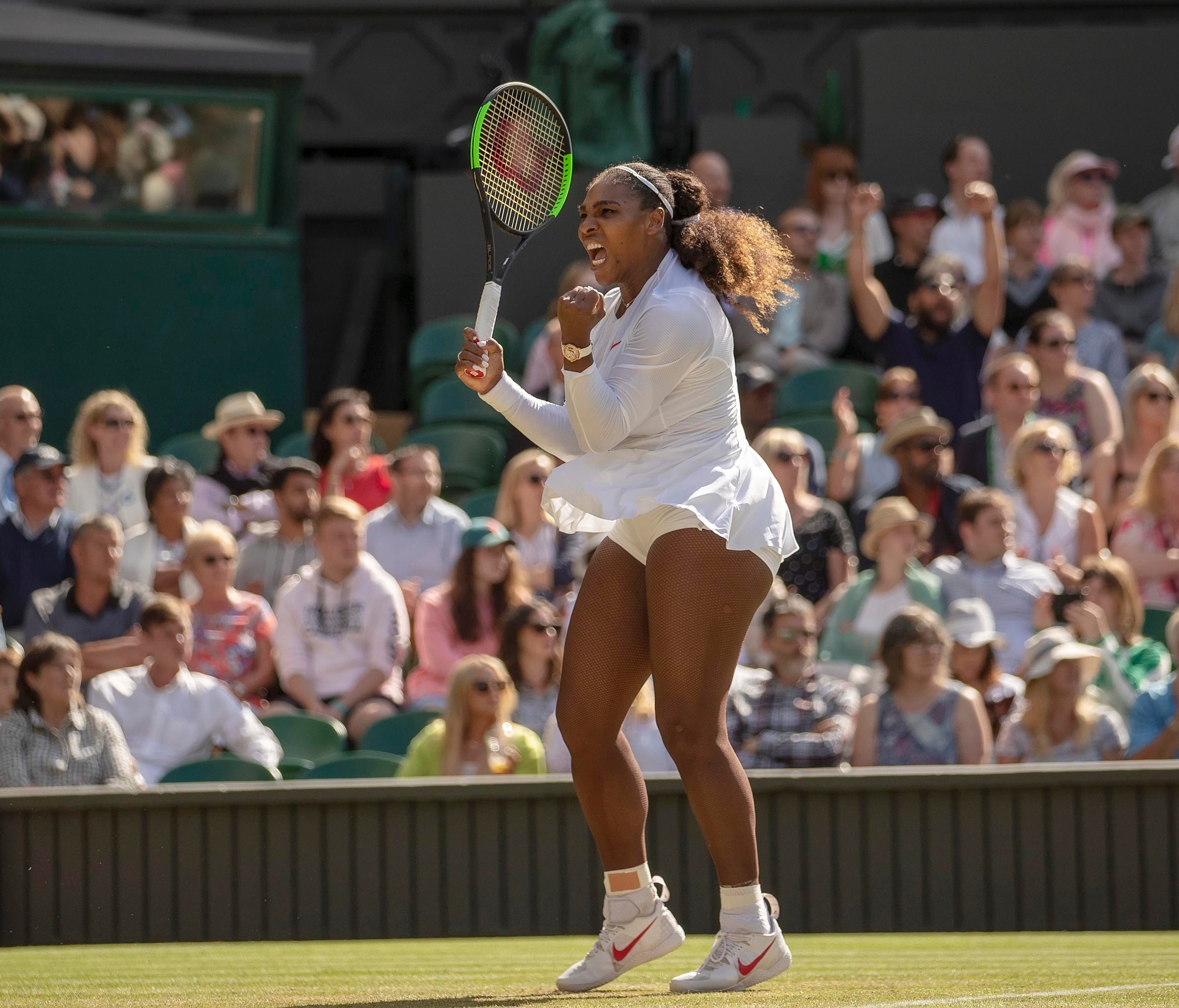 Serena Williams of the US reacts during her match against Camila Giorgi of Italy on day eight at All England Lawn and Croquet Club.