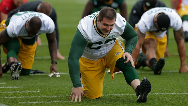 Green Bay Packers center Corey Linsley (63)  stretches  during organized team activities  Tuesday, May 23, 2017.