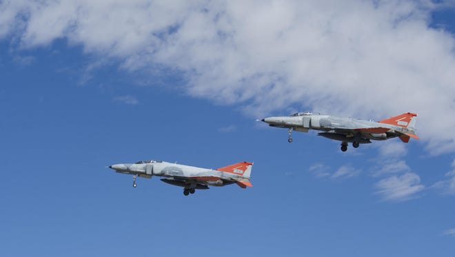 Two QF-4 Phantom IIs fly in formation over Holloman Air Force Base on Sept. 13 in front of 160 spectators participating in Holloman’s annual Phantom Society Tour. The tour enabled aircraft enthusiasts, including veterans and non-veterans with aviation backgrounds, to learn more about Holloman AFB’s aircraft and mission. The tour included an F-16 Fighting Falcon static display and briefing, travel to Holloman’s High Speed Test Track, the opportunity to view QF-4 Phantom IIs and F-16s in flight, and a visit to the base’s heritage park to view static displays of various aircraft historically stationed at Holloman AFB.