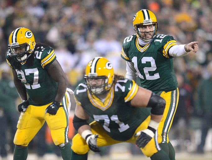 Green Bay Packers quarterback Aaron Rodgers (12) eyes