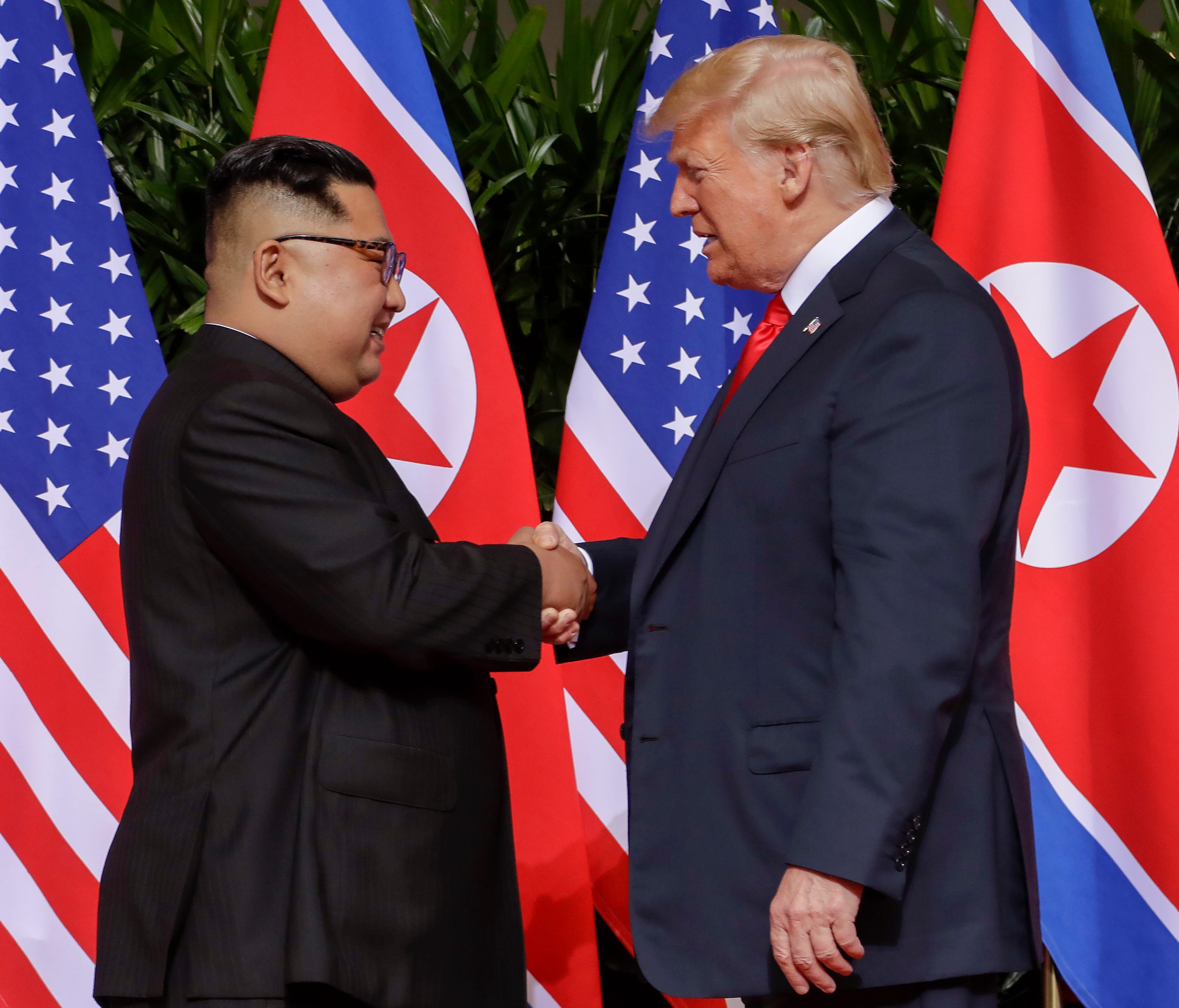 President Trump shakes hands with North Korea leader Kim Jong Un at the Capella resort on Sentosa Island in Singapore.