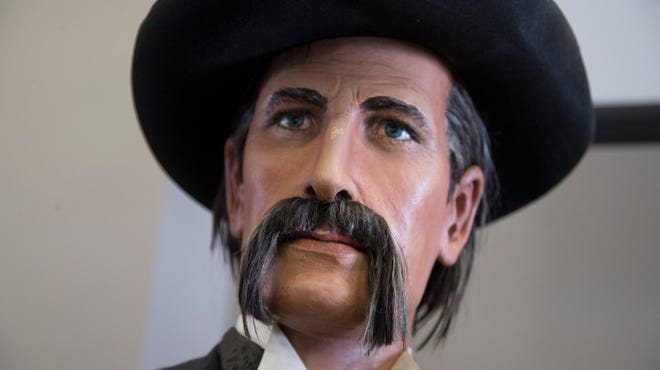 A Wyatt Earp carving by famous Scottsdale artist Dee Flagg sits inside J Levine Auction & Appraisal in Scottsdale.