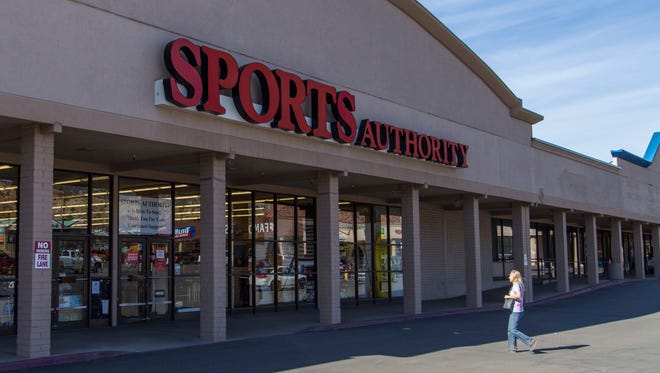 A woman crosses the parking lot to Cedar City's Sports Authority Thursday afternoon, March 10, 2016.