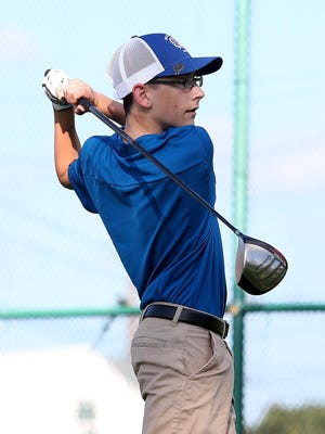 Braintree's Kyle Devin watches his drive at the first hole during his meet against Needham, Weymouth, and Wellesley at Braintree Municipal Golf Course on Wednesday, Oct. 10, 2018.