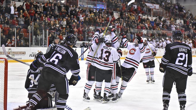 St. Cloud State players celebrate a goal at the Herb Brooks National Hockey Center in St. Cloud. St. Cloud has been named one of the top 10 hockey towns in America by SmartAssets.