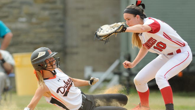 Marlboro High School's Michala Casey slides back to first base unsuccessfully as Center Moriches' Erin Copozzi stares her down during a New York state Class B regional championship game at Rhinebeck on Saturday.