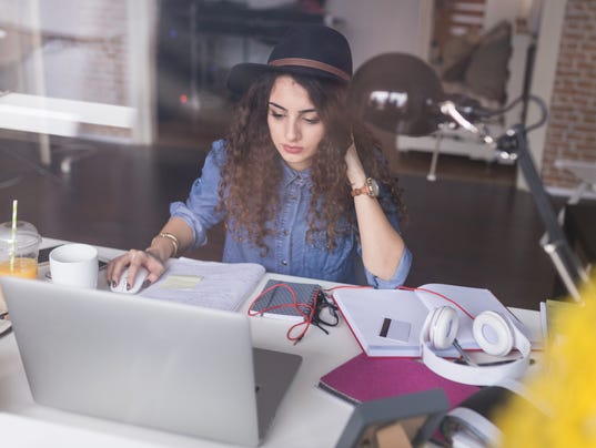 Trough window glass. Designer brainstorming new ideas