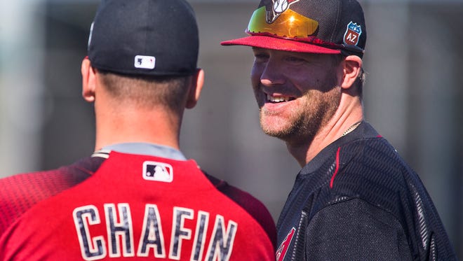 Diamondbacks pitcher Archie Bradley talks to pitcher Andrew Chafin during spring training at Salt River Fields  on Wednesday, Feb. 24, 2016.