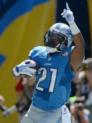 Lions running back Ameer Abdullah celebrates after scoring a touchdown Sunday in San Diego.