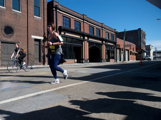 Kristin Seabrook runs along Jackson Ave. during the