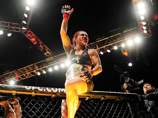 Cris Cyborg celebrates after defeating Holly Holm in