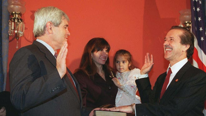 Rep. Sonny Bono, R-Calif., right, re-enacts his oath of office from House Speaker Newt Gingrich on Jan. 4, 1995, on Capitol Hill. Bono's wife Mary holds the Bible and their daughter Chianna as Bono's son Chesare huddles underneath. Bono was killed in an apparent skiing accident Monday, Jan. 5, 1998, at Heavenly Ski Resort on the Nevada-California state line.