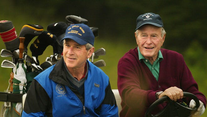 George W. Bush, left, and his father, George H.W. Bush. A Desert Sun reader suggests George W. Bush should've followed his father's example when it came to war in the Middle East.