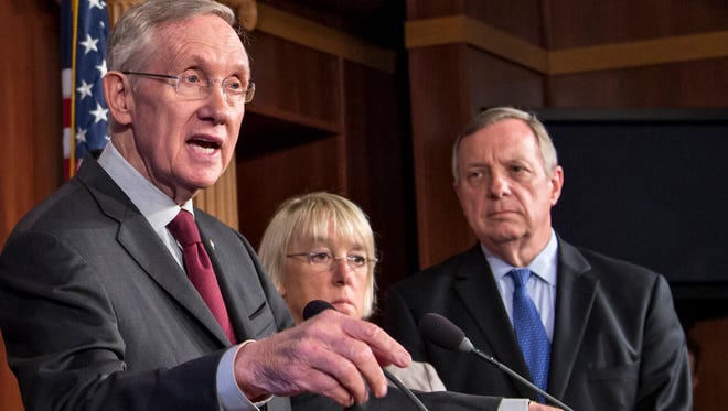 From left, Senate Majority Leader Harry Reid of Nevada, Senate Budget Committee Chair  Patty Murray, D-Wash., and Senate Majority Whip Richard Durbin of Illinois during a news conference Sept. 30.