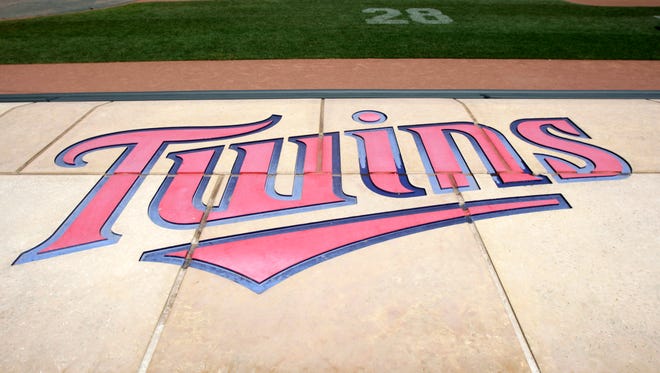 The Twins' logo is displayed on the Twins dugout at Target Field before a baseball game, between the Minnesota Twins and the Detroit Tigers, Sunday, July 24, 2011, in Minneapolis. (AP Photo/Paul Battaglia)