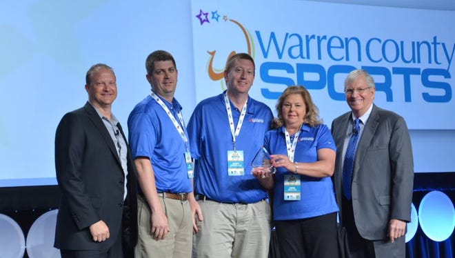 Members of the sports division of the Warren County Convention & Visitors Bureau accept the award for Sports Tourism Organization of the year Tuesday at the National Association of Sports Commission’s annual symposium in Milwaukee, Wisconsin.